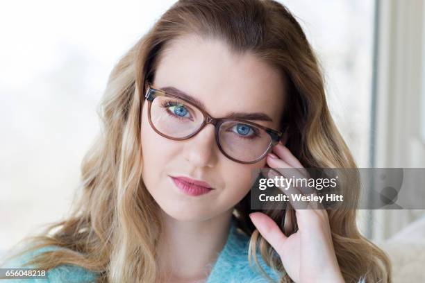 young woman looking stressed as she studies for test - actors with blonde hair and blue eyes stock pictures, royalty-free photos & images