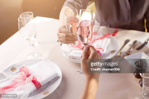hand of couple lover holding smart-phone  and waiting for order food for valentins day - valentines day dinner bildbanksfoton och bilder