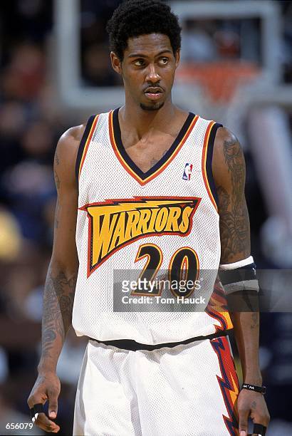 Larry Hughes of the Golden State Warriors looks on from the court during the game against the Utah Jazz at The Arena of Oakland in California. The...