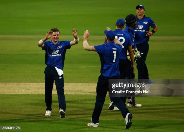 Mason Crane of The South celebrates with teammates after dismissing Liam Livingstone of The North during Game Three of the ECB North versus South...