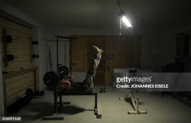German soldier exercises in the DHQ in the province of Kunduz, during the night, on March 30, 2012. Germany is the third biggest supplier of troops...