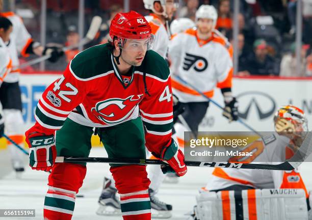 John Quenneville of the New Jersey Devils warms up before a game against the Philadelphia Flyers on March 16, 2017 at Prudential Center in Newark,...