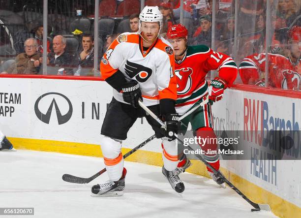 Sean Couturier of the Philadelphia Flyers in action against the New Jersey Devils on March 16, 2017 at Prudential Center in Newark, New Jersey. The...