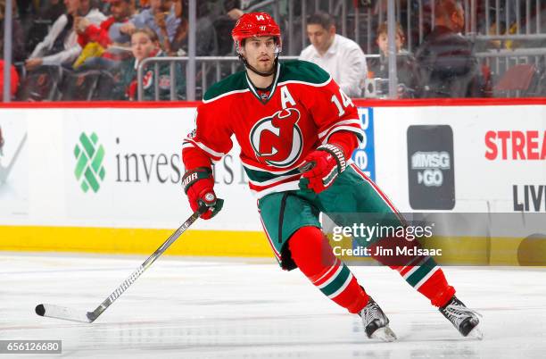 Adam Henrique of the New Jersey Devils in action against the Philadelphia Flyers on March 16, 2017 at Prudential Center in Newark, New Jersey. The...