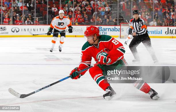 Beau Bennett of the New Jersey Devils in action against the Philadelphia Flyers on March 16, 2017 at Prudential Center in Newark, New Jersey. The...