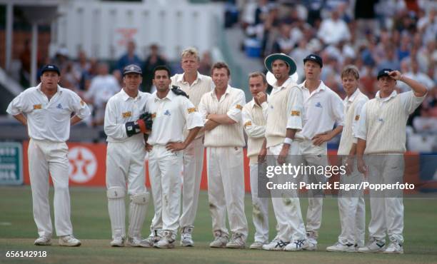 The England team wait for the television umpire to rule on a run-out attempt by England captain Mike Atherton during the 3rd Texaco Trophy One Day...