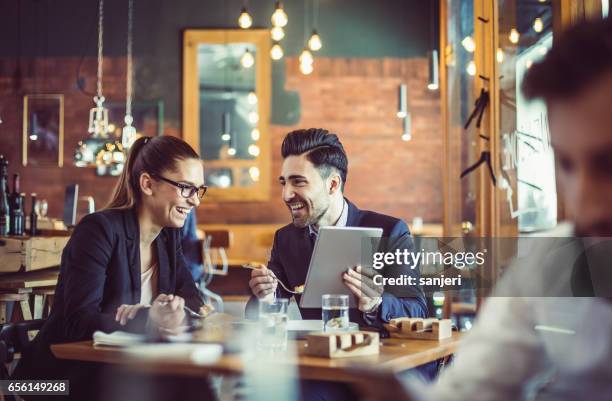 business people at the cafe restaurant discussing during business lunch - breakfast meeting stock pictures, royalty-free photos & images