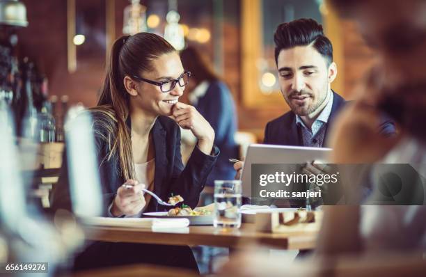 business people at the cafe restaurant discussing during business lunch - hotel breakfast stock pictures, royalty-free photos & images