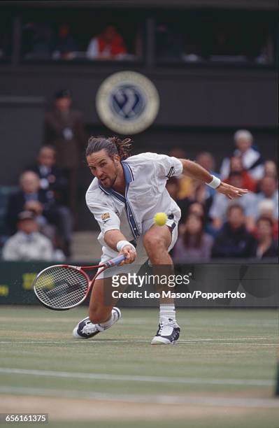 Australian tennis player Pat Rafter pictured competing to progress to reach the final of the Men's Singles tournament before losing to Pete Sampras,...