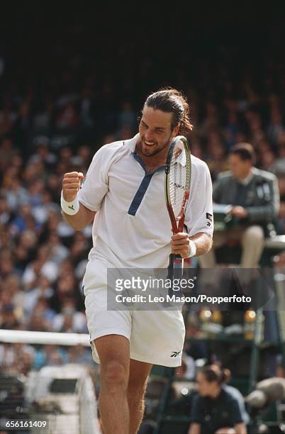 Australian tennis player Pat Rafter pictured competing to progress to reach the final of the Men's Singles tournament before losing to Pete Sampras,...