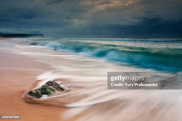 stormy morning on beach - mona vale stock pictures, royalty-free photos & images