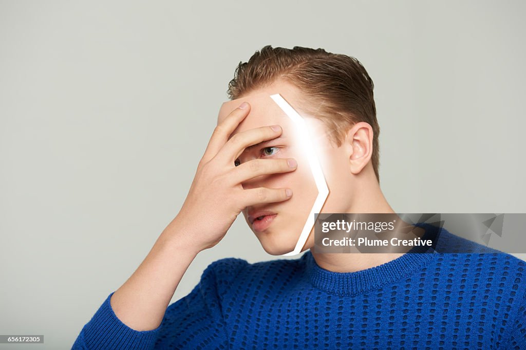 Android man removing his face