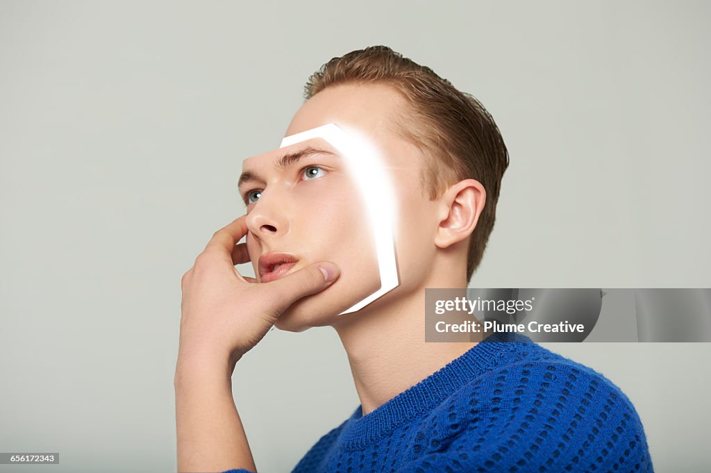 Android man removing his face