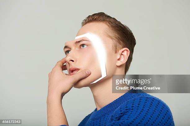 android man removing his face - cyborg stock pictures, royalty-free photos & images