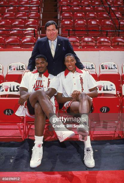 Portrait of Chicago Bulls General Manager Jerry Krause with Charles Oakley and Scottie Pippen posing on court at the United Center. Chicago, IL...