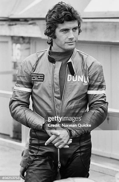Italian road racer Giacomo Agostini practising at Silverstone, UK, 20th August 1971. He is wearing a Lewis Leathers jacket with the Dunlop logo on it.