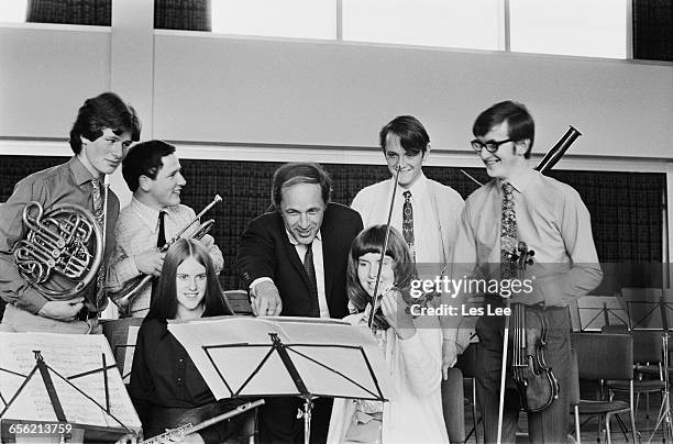 Members of the National Youth Orchestra of Great Britain, UK, 16th August 1971. From left to right, Martin Mayes on the French horn, John Miller on...