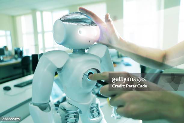 robot being worked on - innovation lab stock pictures, royalty-free photos & images