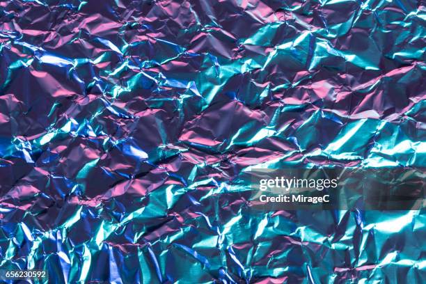 foil texture in blue and purple color - reflector stock-fotos und bilder