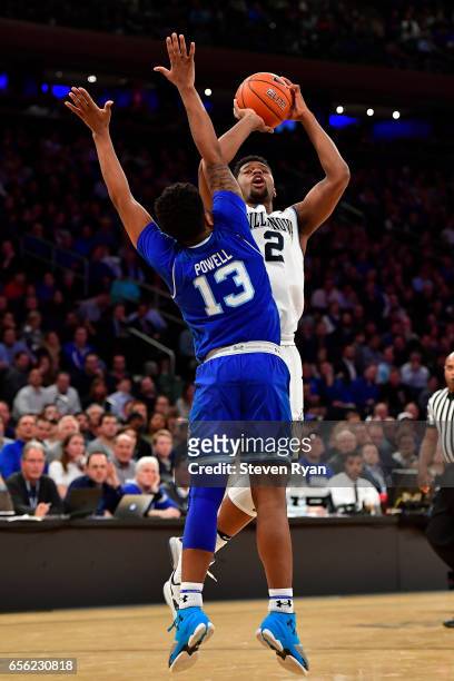 Kris Jenkins of the Villanova Wildcats attempts a shot defended by Myles Powell of the Seton Hall Pirates during the Big East Basketball Tournament -...