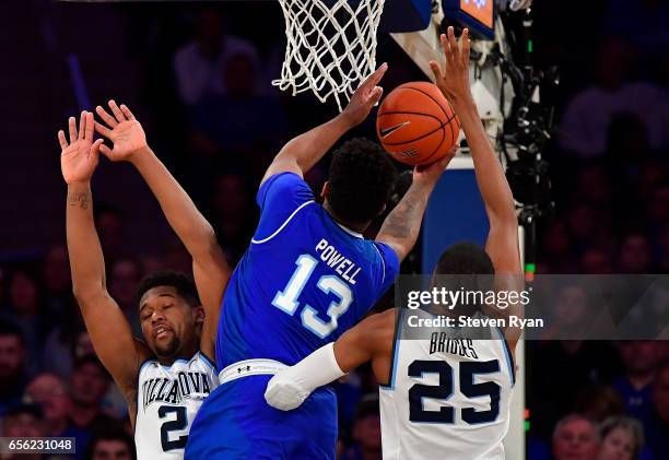 Myles Powell of the Seton Hall Pirates attempts a shot past Kris Jenkins and Mikal Bridges of the Villanova Wildcats during the Big East Basketball...