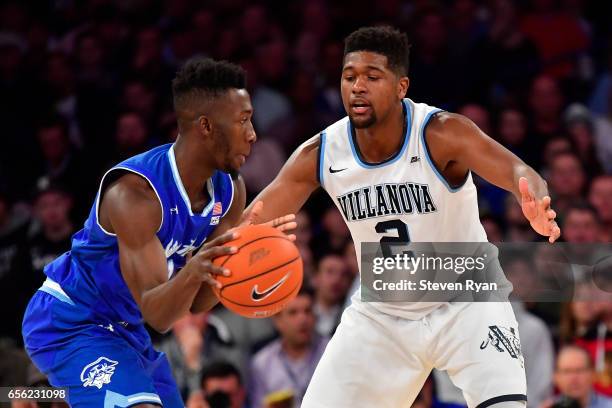 Myles Powell of the Seton Hall Pirates is defended by Kris Jenkins of the Villanova Wildcats during the Big East Basketball Tournament - Semifinals...