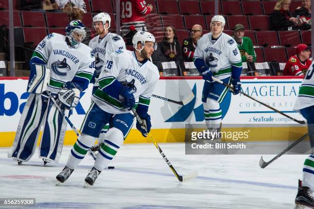 Joseph Cramarossa of the Vancouver Canucks warms up with teammates prior to the game against the Chicago Blackhawks at the United Center on March 21,...