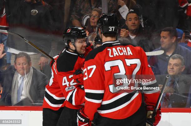 John Quenneville of the New Jersey Devils celebrates his first NHL goal against the New York Rangers on the powerplay at 15:16 of the second period...