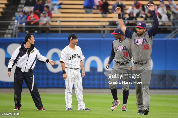 Norichika Aoki of the Japan and Adam Jones of the United States greet eachother on the field before the start of Game 2 of the Championship Round of...