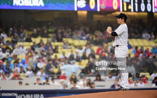 Tomoyuki Sugano of the Japan pitches in the first inning against team United States during Game 2 of the Championship Round of the 2017 World...