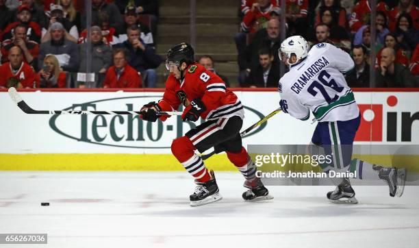 Nick Schmaltz of the Chicago Blackhawks chases the puck followed by Joseph Cramarossa of the Vancouver Canucks at the United Center on March 21, 2017...