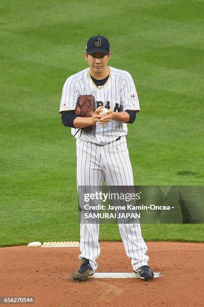 Tomoyuki Sugano of team Japan pitches against team United States in the first inning during Game 2 of the Championship Round of the 2017 World...