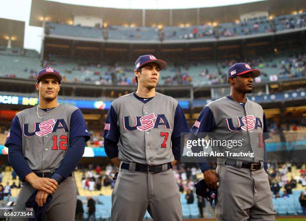 Nolan Arenado, Christian Yelich and Adam Jones of Team USA are seen on the field during introductions before Game 2 of the Championship Round of the...