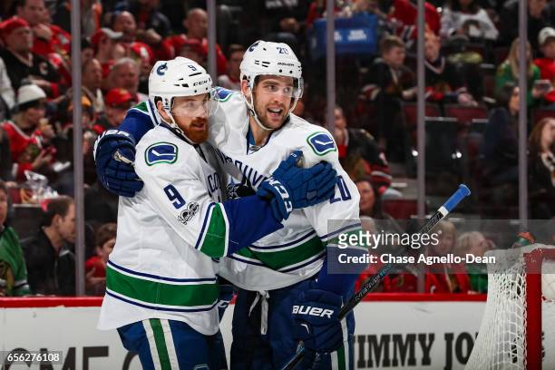 Jack Skille and Brandon Sutter of the Vancouver Canucks celebrate after Sutter scored against the Chicago Blackhawks in the third period at the...