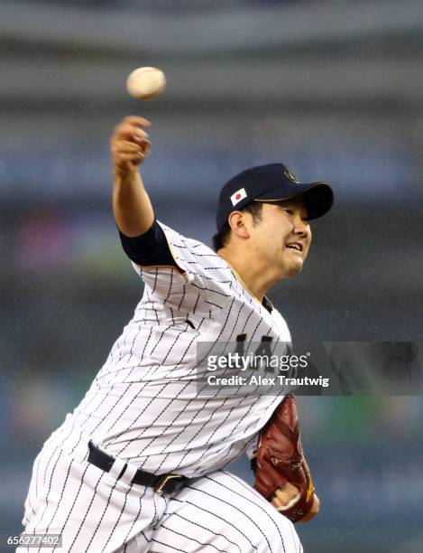 Tomoyuki Sugano of Team Japan pitches during Game 2 of the Championship Round of the 2017 World Baseball Classic against Team USA on Tuesday, March...