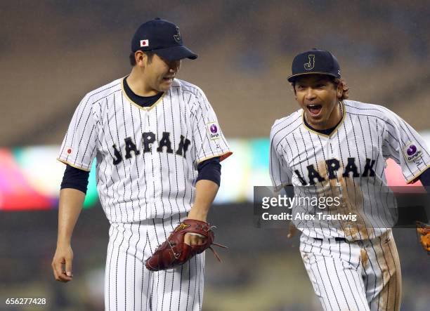 Tomoyuki Sugano and Nobuhiro Matsuda of Team Japan react in the top of the third inning of Game 2 of the Championship Round of the 2017 World...