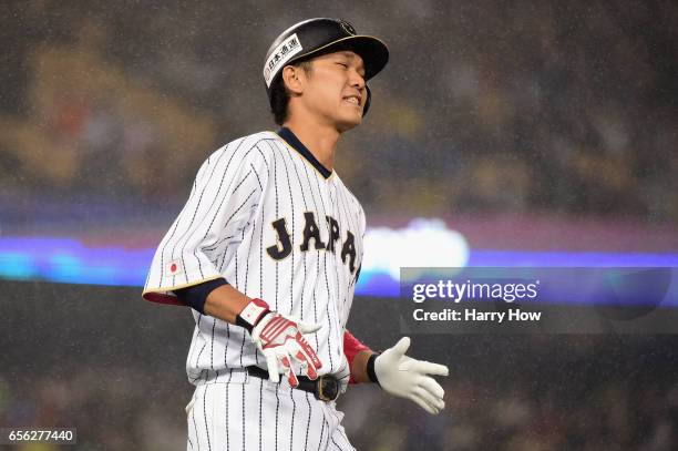 Hayato Sakamoto of team Japan reacts as he flies out to end the fourth inning against team United States during Game 2 of the Championship Round of...