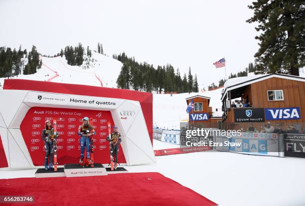 Second place finisher Federica Brignone of Italy, first place finisher Mikaela Shiffrin of the United States, and third place finisher Tessa Worley...