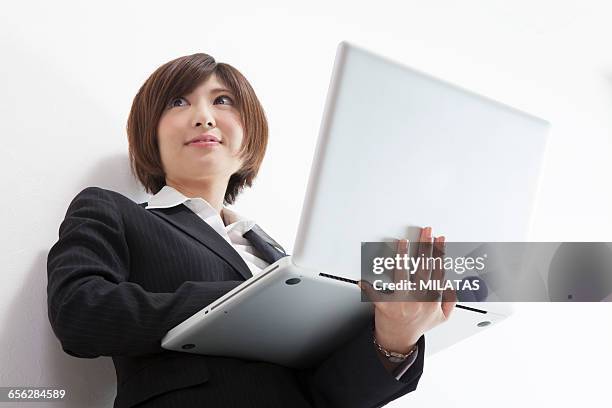 japanese female company employee with a personal computer - newbie stock pictures, royalty-free photos & images