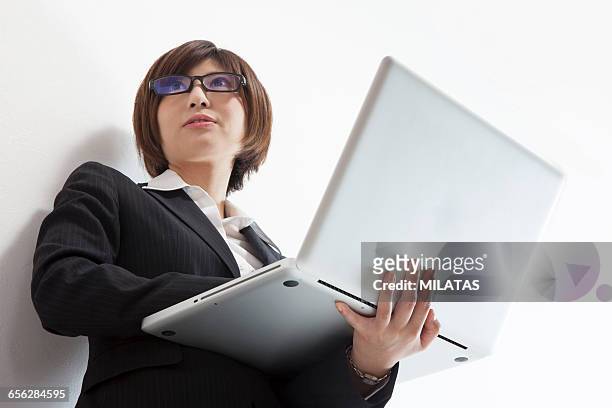 japanese female company employee with a personal computer - newbie stock pictures, royalty-free photos & images