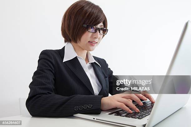 japanese female company employee to a personal computer - newbie stock pictures, royalty-free photos & images