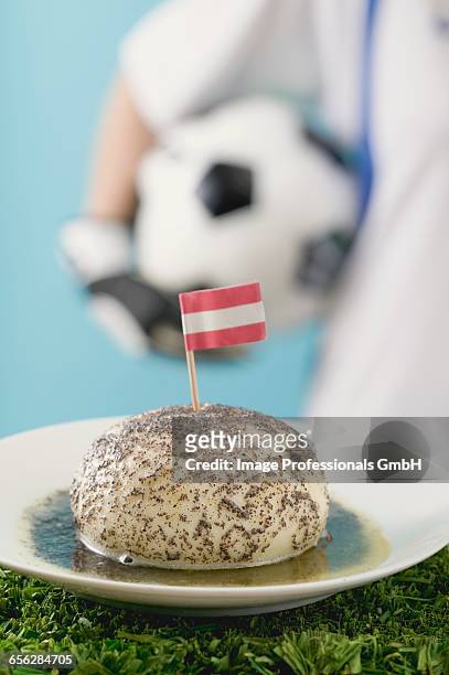 yeast dumpling with flag, footballer in background - fat soccer players stock pictures, royalty-free photos & images