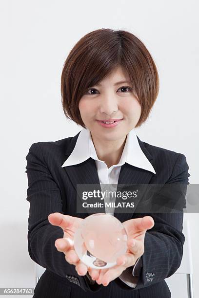 japanese female company employee with a globe - newbie stock pictures, royalty-free photos & images