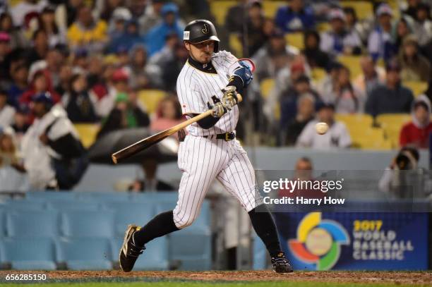 Ryosuke Kikuchi of team Japan hits a game-tying home run in the sixth inning against team United States during Game 2 of the Championship Round of...