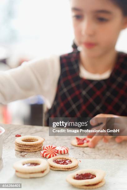 girl making jam biscuits - jam making generations photos et images de collection