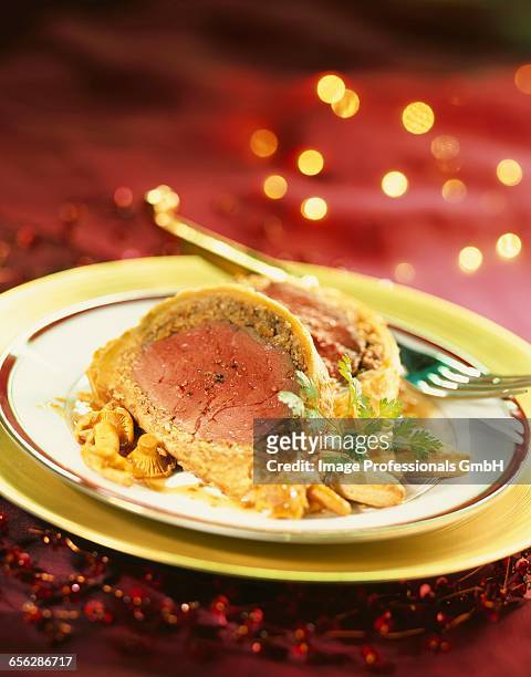 beef fillet in pastry crust with mushrooms - cantharellus tubaeformis stock pictures, royalty-free photos & images