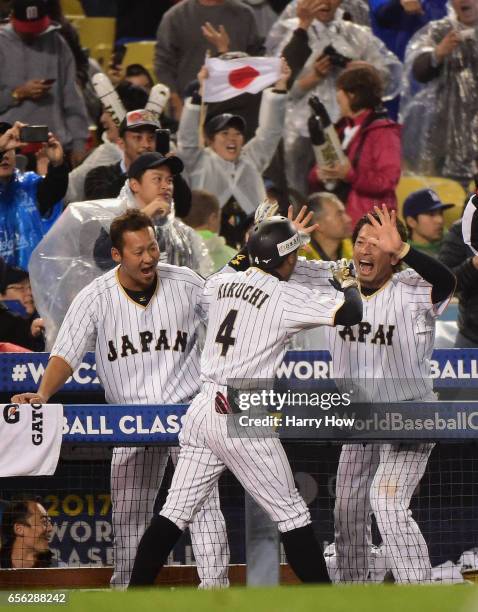 Ryosuke Kikuchi of team Japan celebrates his game-tying home run with Shogo Akiyama in the sixth inning against team United States during Game 2 of...