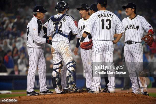 Nobuhiro Matsuda of Team Japan talks with teammates during a coaching visit to the mound during Game 2 of the Championship Round of the 2017 World...