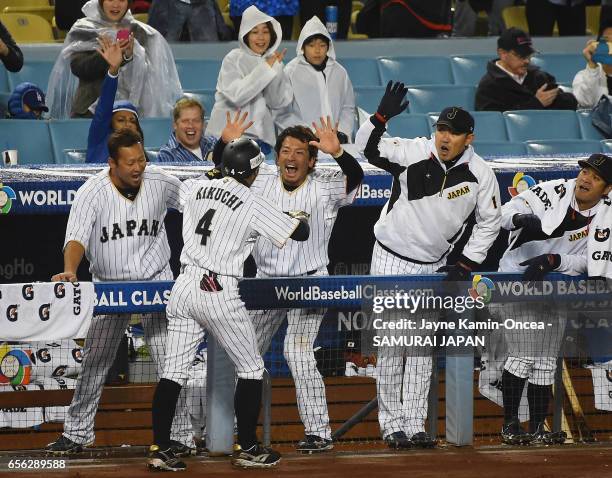 Ryosuke Kikuchi of team Japan celebrates his game-tying home run with teammates in the sixth inning against team United States during Game 2 of the...