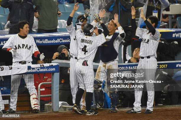 Ryosuke Kikuchi of team Japan celebrates his game-tying home run with teammates in the sixth inning against team United States during Game 2 of the...